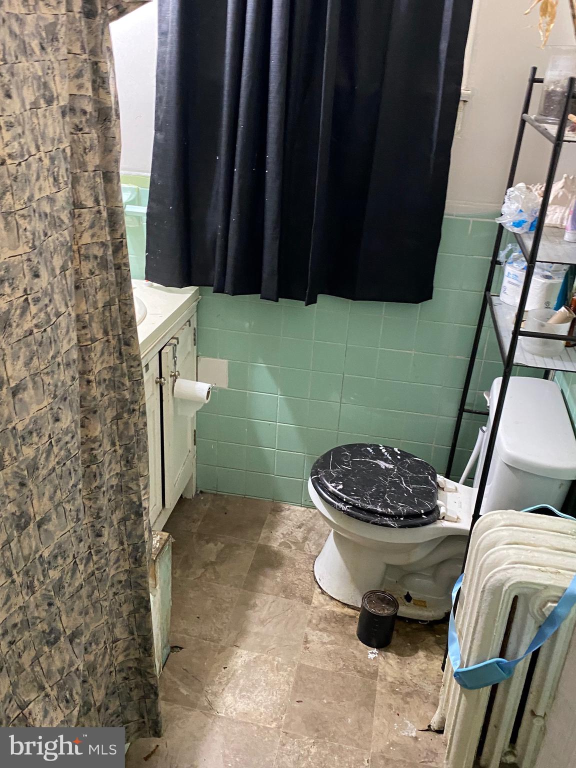 5336 Race Street Philadelphia, PA 19139 - Photo 13 of 23 a bathroom with a toilet and a sink