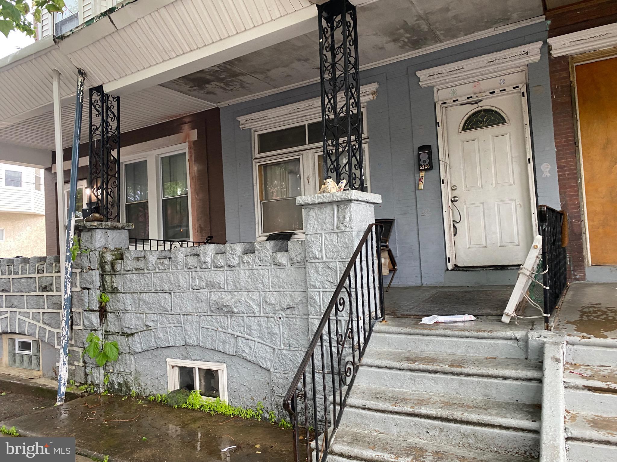 5336 Race Street Philadelphia, PA 19139 - Photo 2 of 23 a front view of a house with a yard