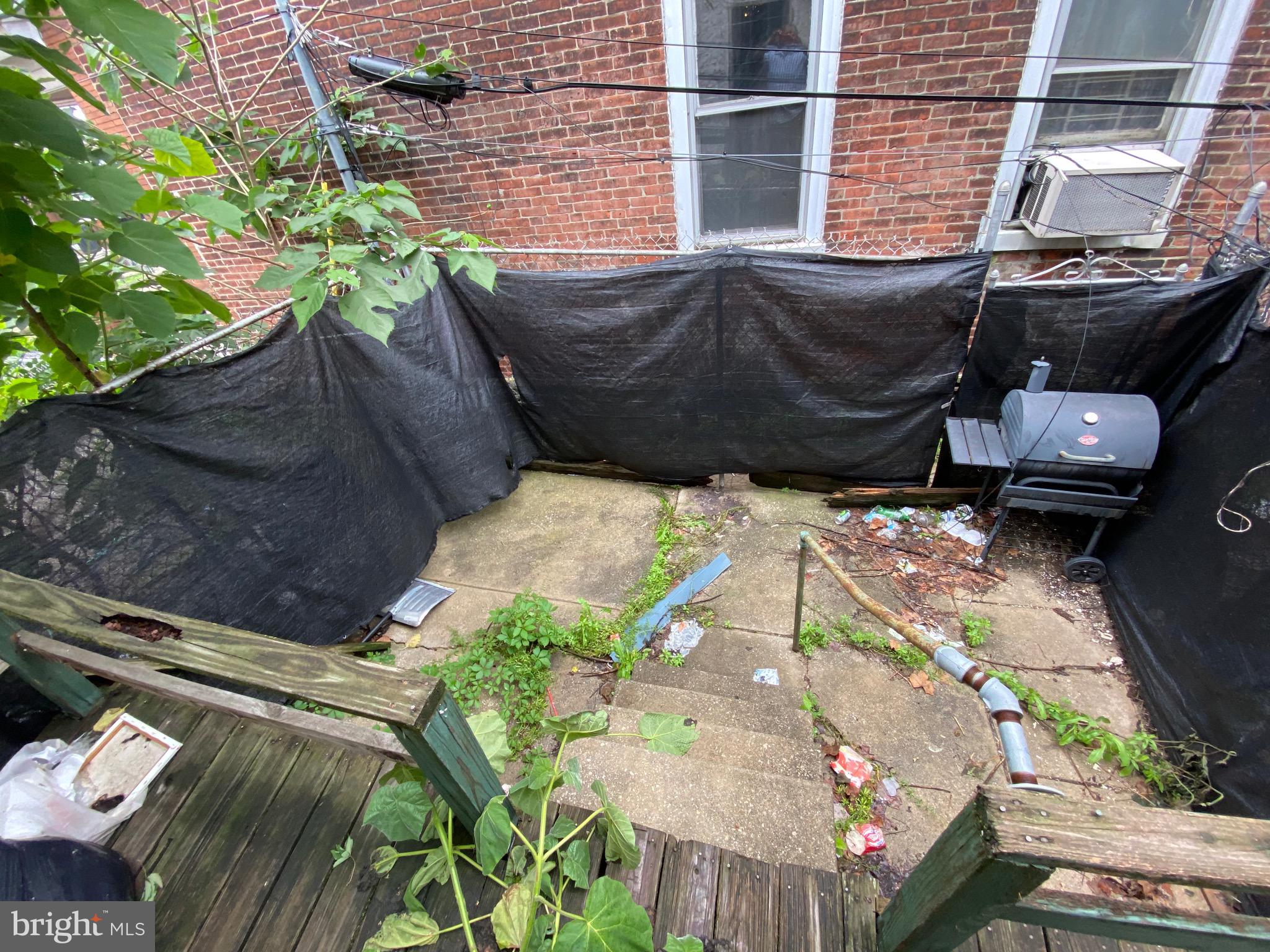 5336 Race Street Philadelphia, PA 19139 - Photo 22 of 23 a backyard of a house with outdoor seating