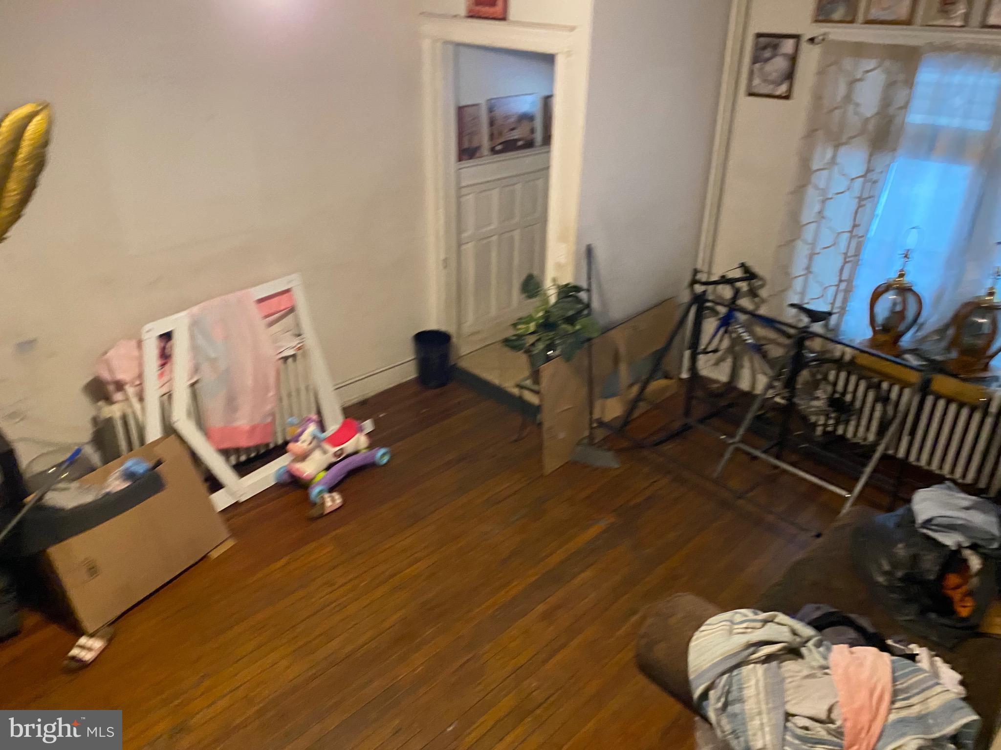 5336 Race Street Philadelphia, PA 19139 - Photo 6 of 23 a living room with furniture and a wooden floor