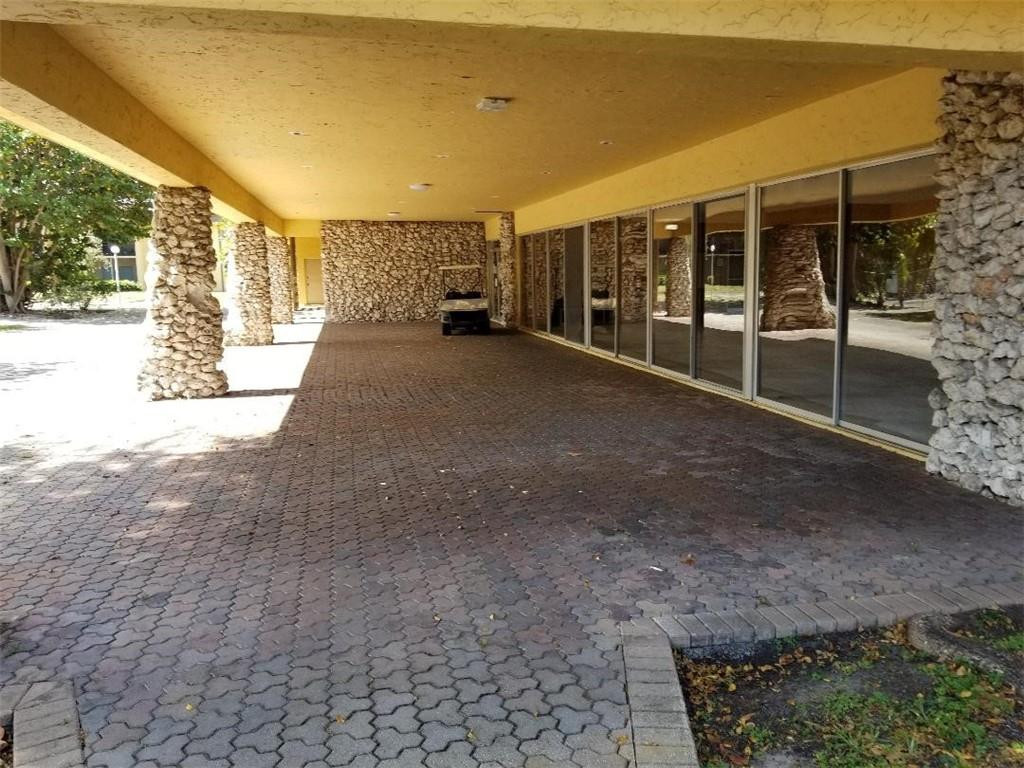 2874 Northwest 55th Avenue, Unit 1D Lauderhill, FL 33313 - Photo 1 of 4 CLUB HOUSE PATIO OVERLOOKING THE POOL