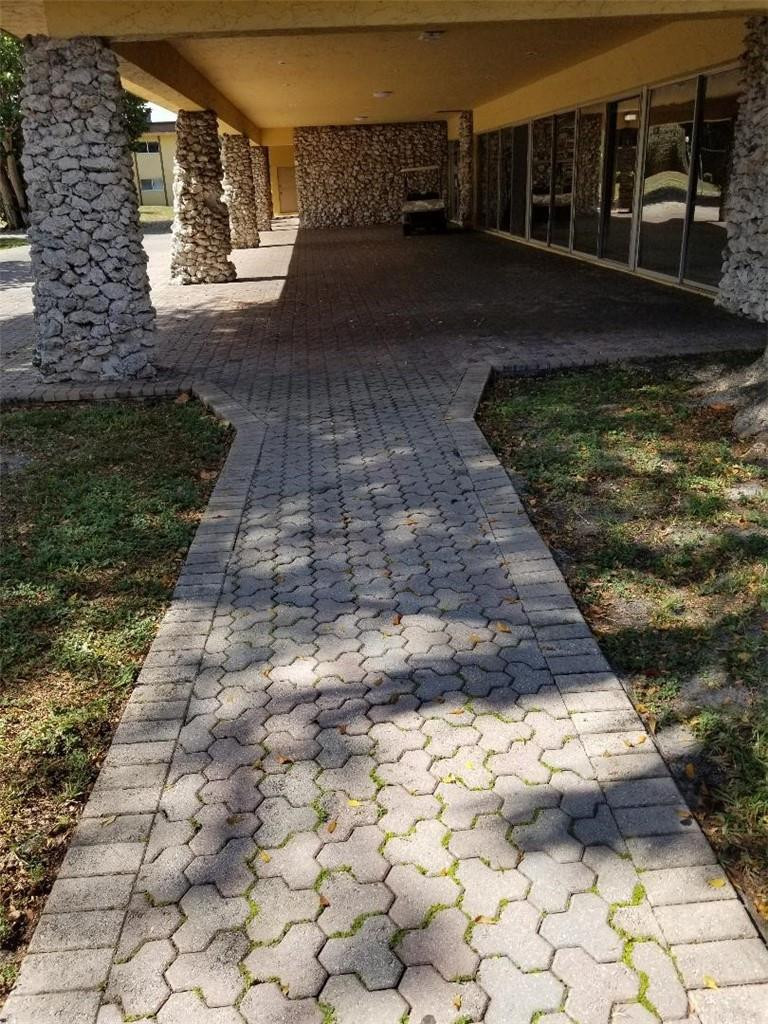 2874 Northwest 55th Avenue, Unit 1D Lauderhill, FL 33313 - Photo 2 of 4 CLUB HOUSE PATIO WALK WAY