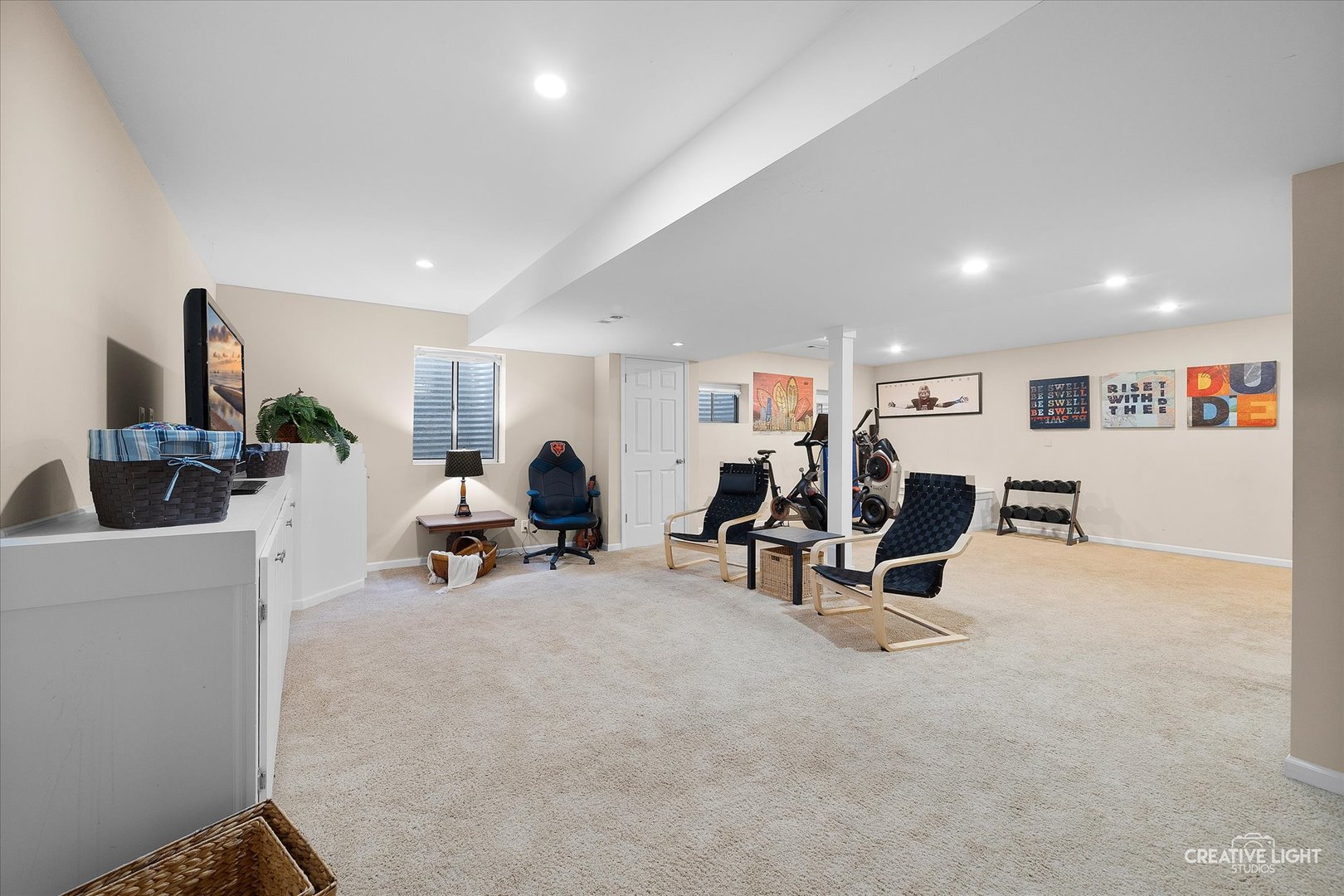 1185 Lewis Road Geneva, IL 60134 - Photo 20 of 28 a living room with furniture and a flat screen tv