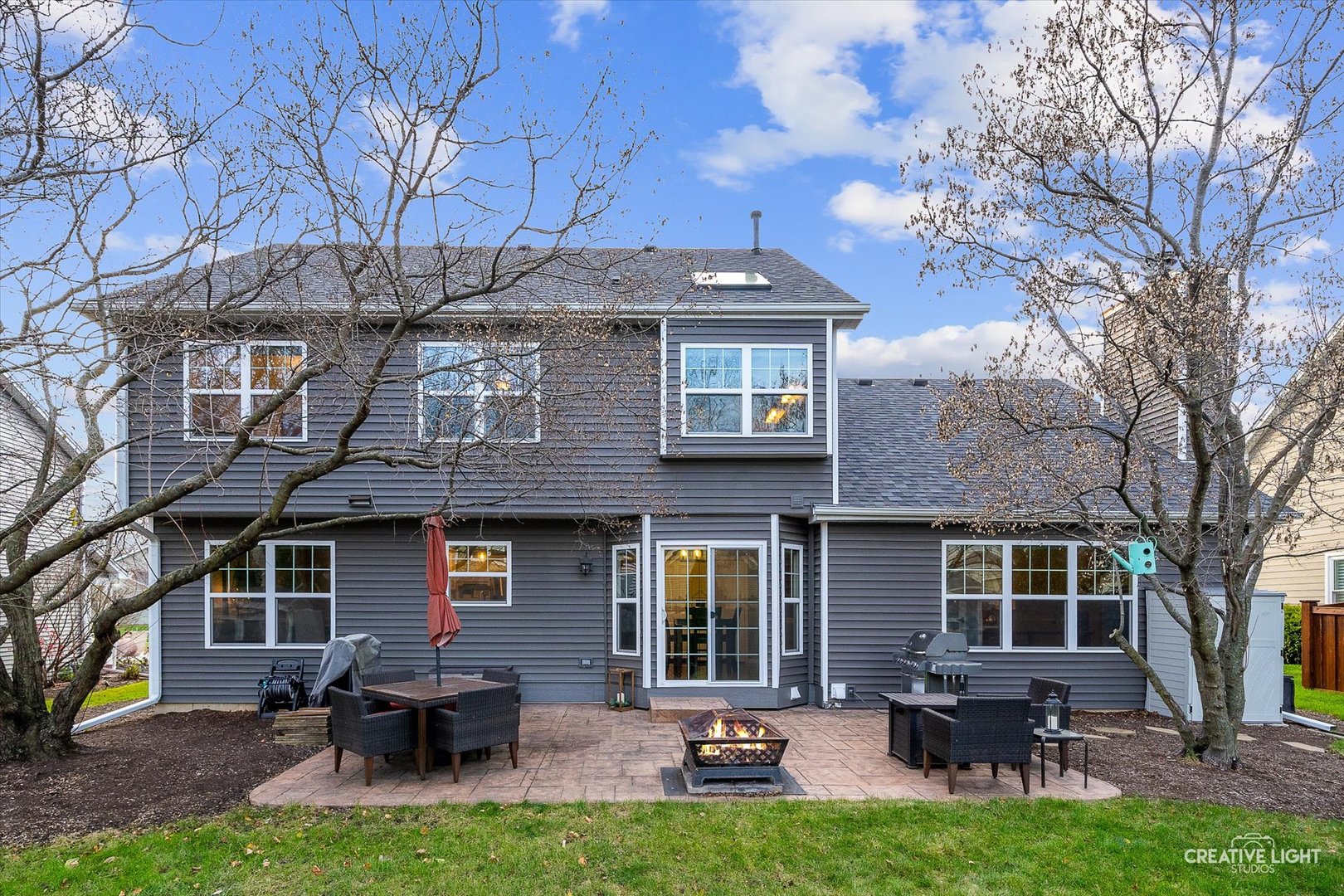 1185 Lewis Road Geneva, IL 60134 - Photo 24 of 28 a view of a house with furniture and a yard