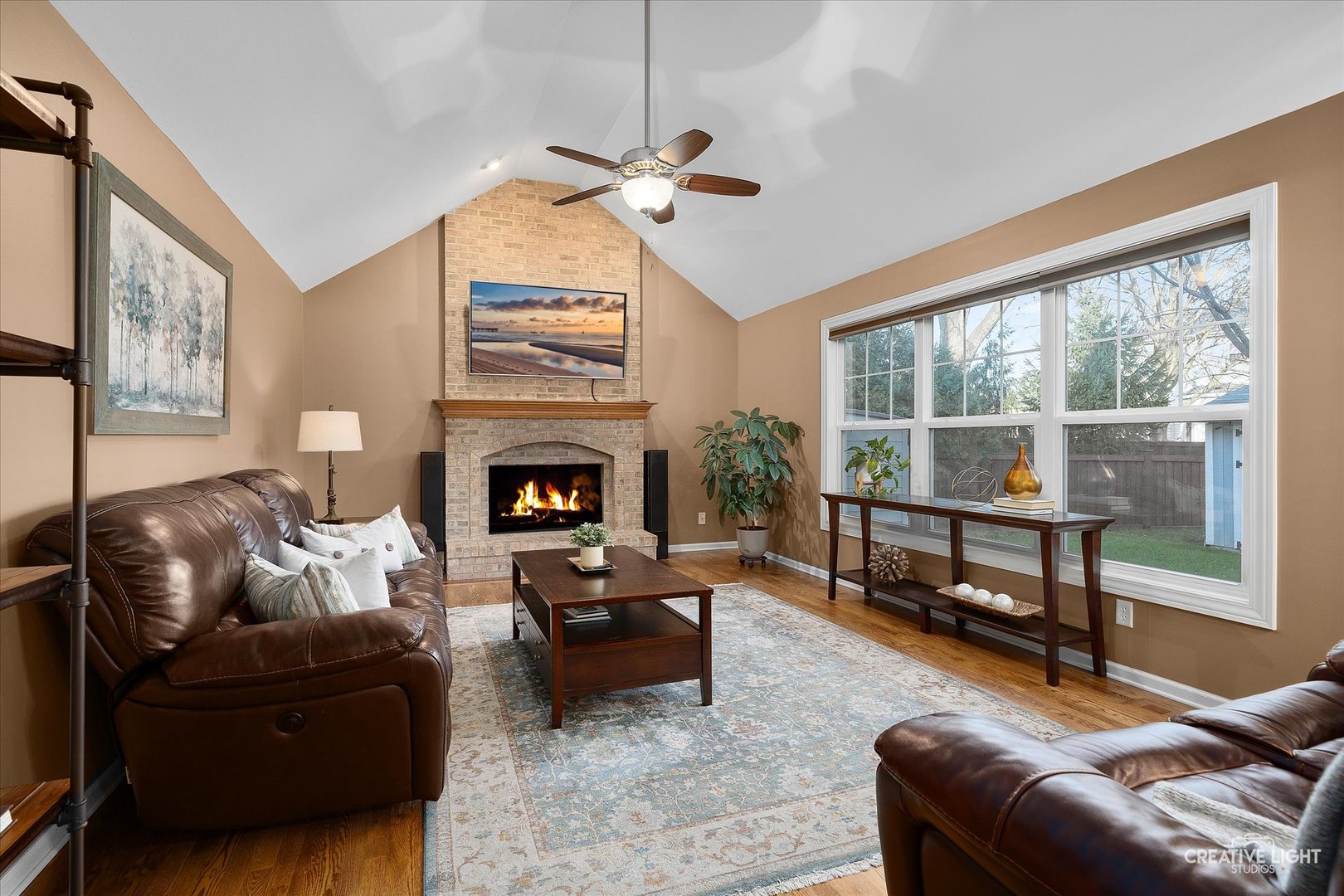 1185 Lewis Road Geneva, IL 60134 - Photo 5 of 28 a living room with furniture and a fireplace