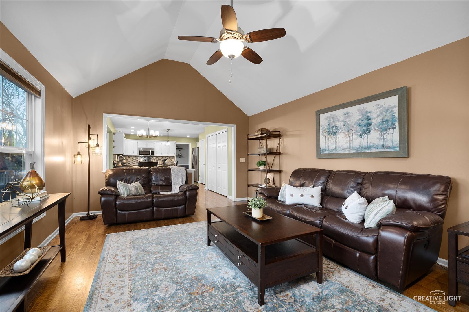 1185 Lewis Road Geneva, IL 60134 - Photo 6 of 28 a living room with furniture ceiling fan and a rug