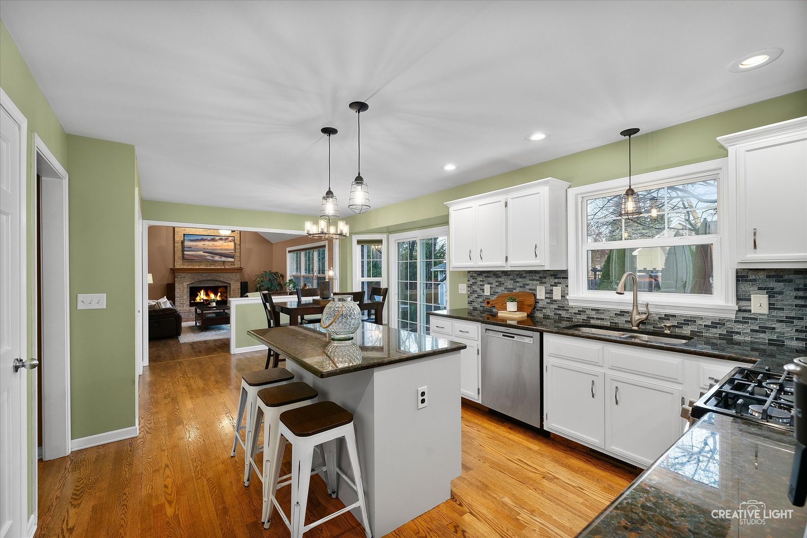 1185 Lewis Road Geneva, IL 60134 - Photo 9 of 28 a kitchen with a sink stove and cabinets