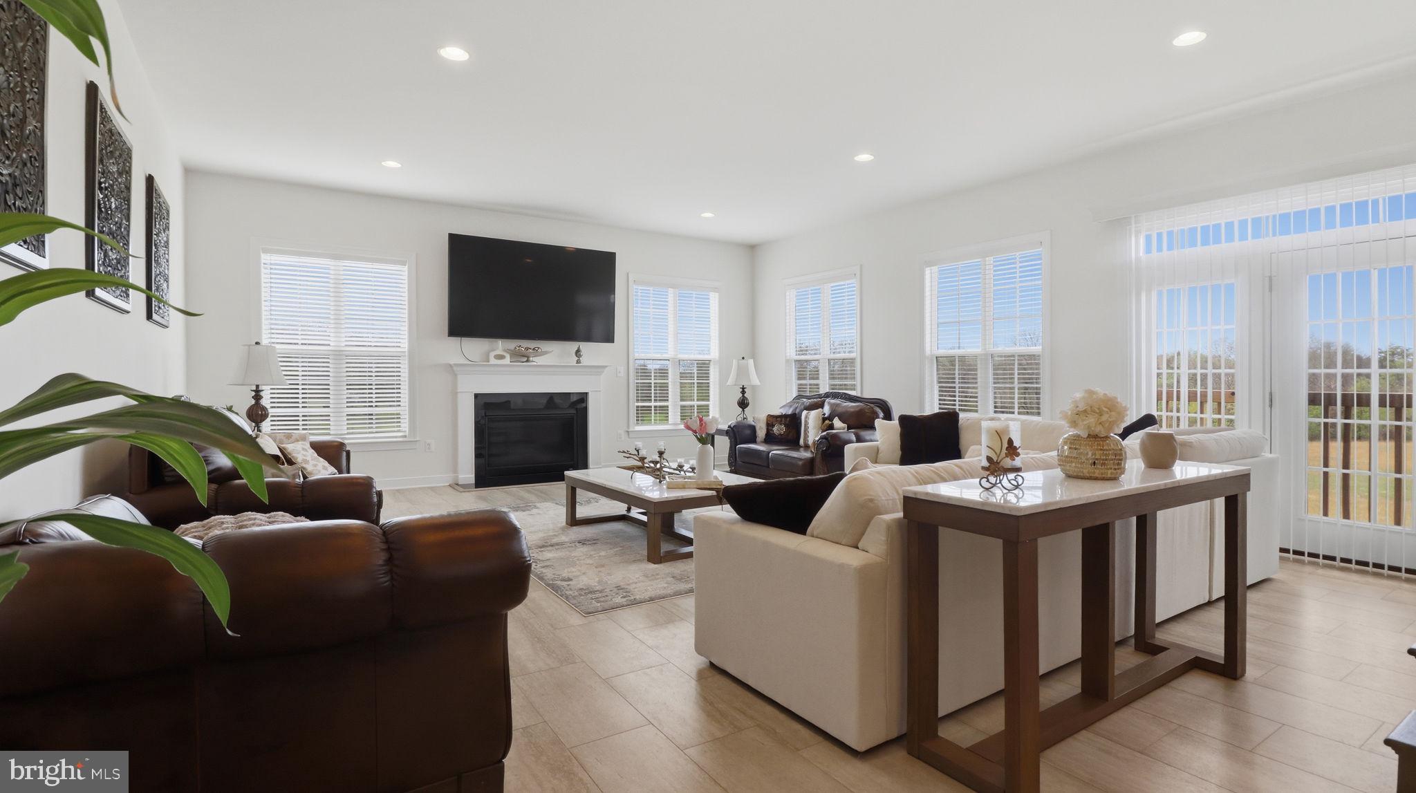 11502 Aden Road Nokesville, VA 20181 - Photo 41 of 106 a living room with furniture fireplace and a flat screen tv