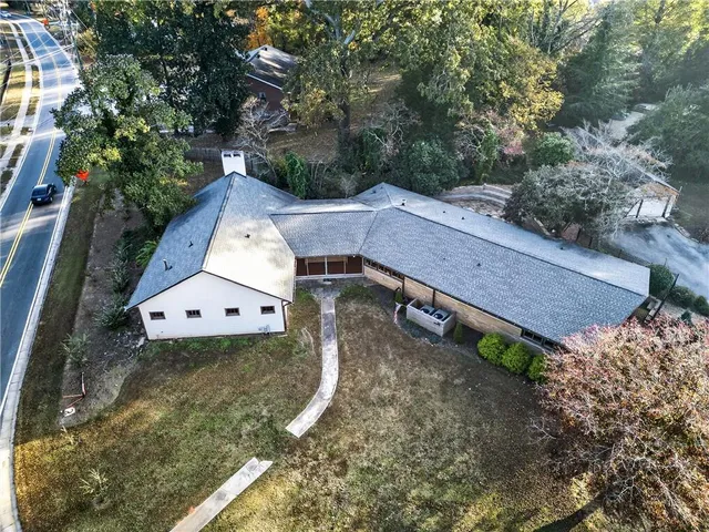 a aerial view of a house with a yard