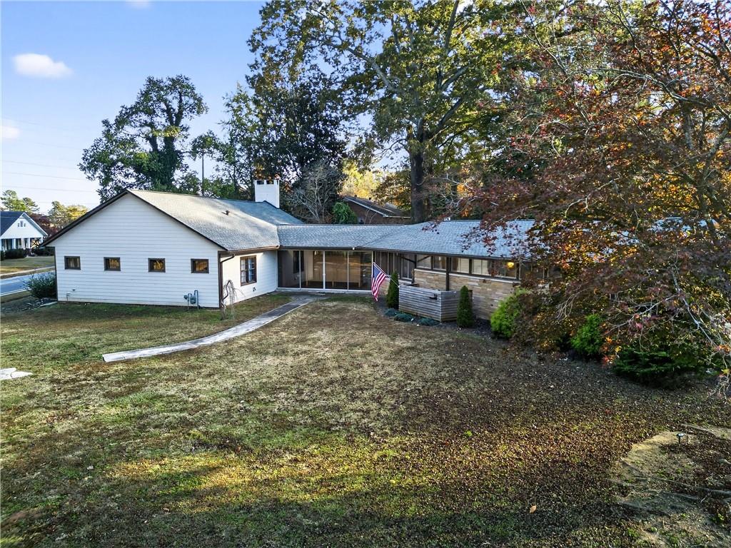 32 McDonough Street Hampton, GA 30228 - Photo 25 of 59 a view of a house with a yard