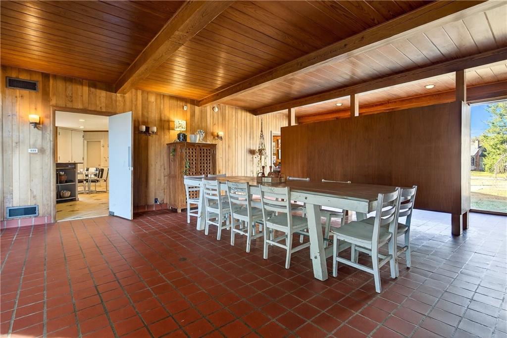 32 McDonough Street Hampton, GA 30228 - Photo 37 of 59 a view of a dining room with furniture and wooden floor