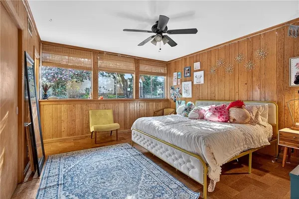 a bed room with a bed and a chandelier
