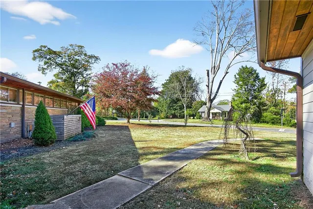 a view of swimming pool with a yard