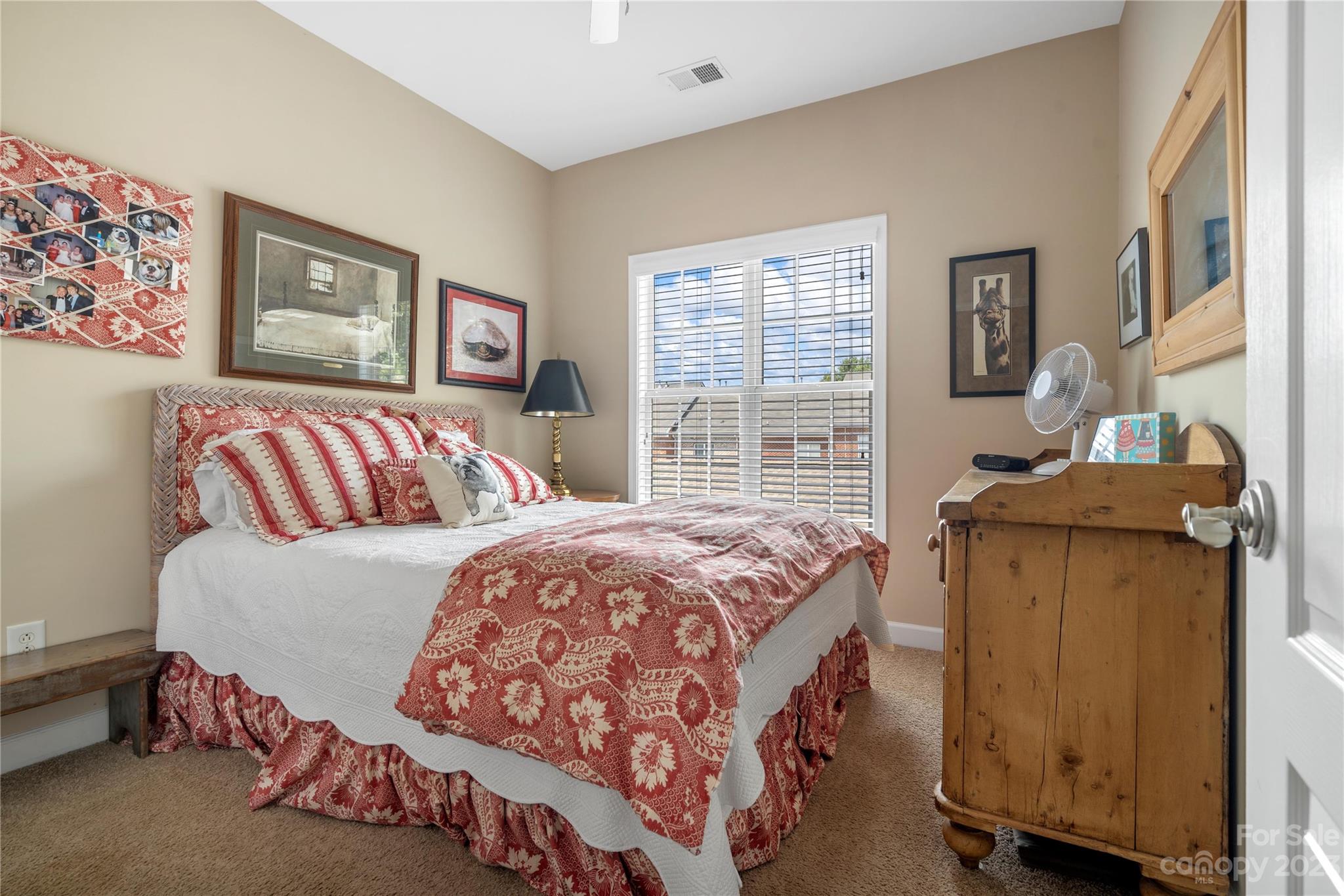 118 Singleton Road Mooresville, NC 28117 - Photo 17 of 28 a bedroom with a bed and wooden floor