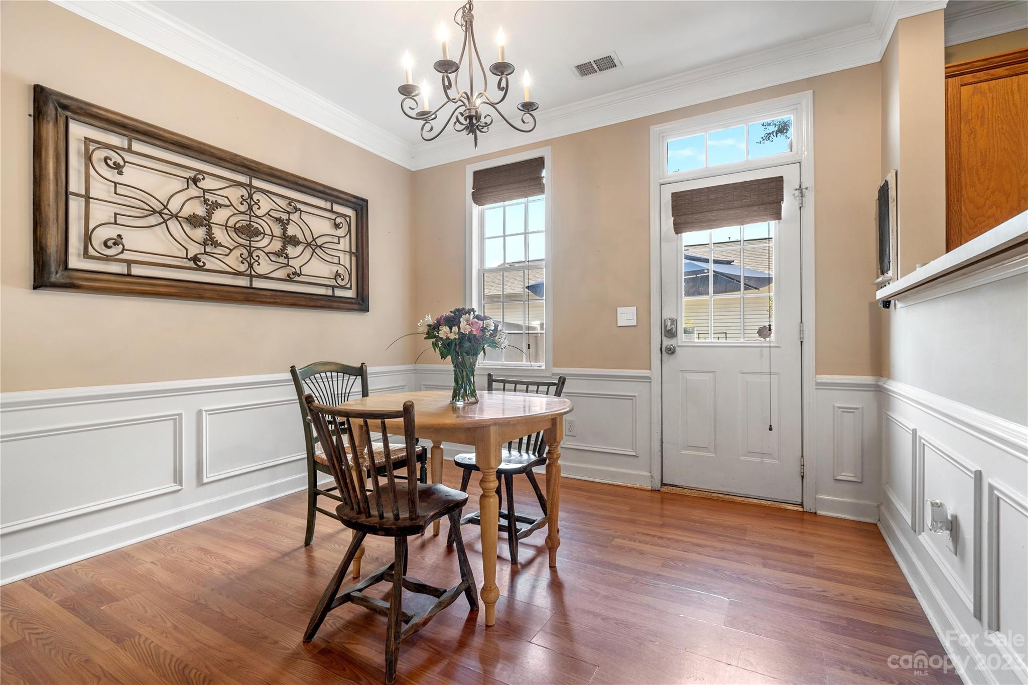 118 Singleton Road Mooresville, NC 28117 - Photo 6 of 28 a view of a dining room with furniture wooden floor and chandelier