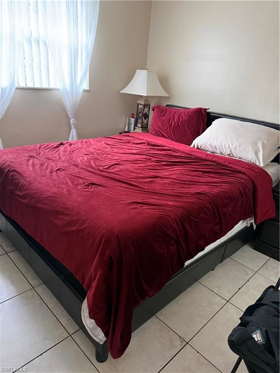 3325 Airport Road North, Unit R6 Naples, FL 34105 - Photo 9 of 11 Bedroom with light tile patterned floors