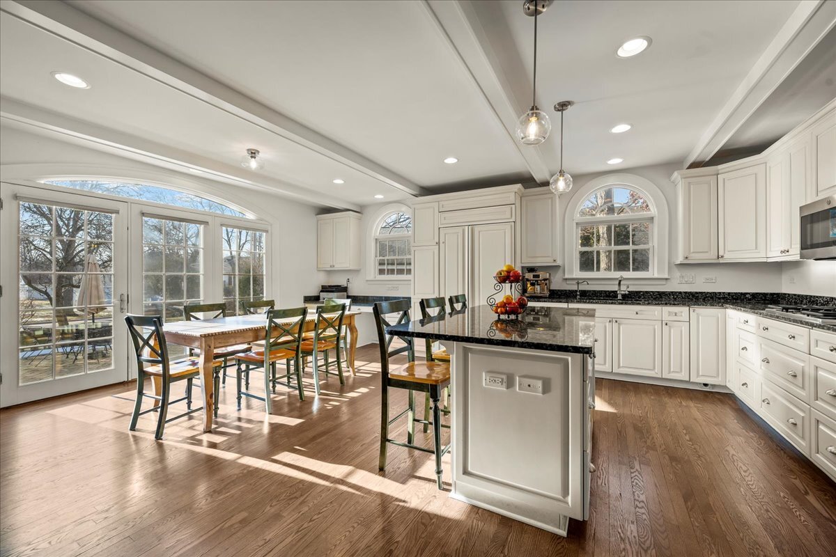 1878 Sunset Road Highland Park, IL 60035 - Photo 11 of 40 a large white kitchen with lots of counter space a sink and appliances