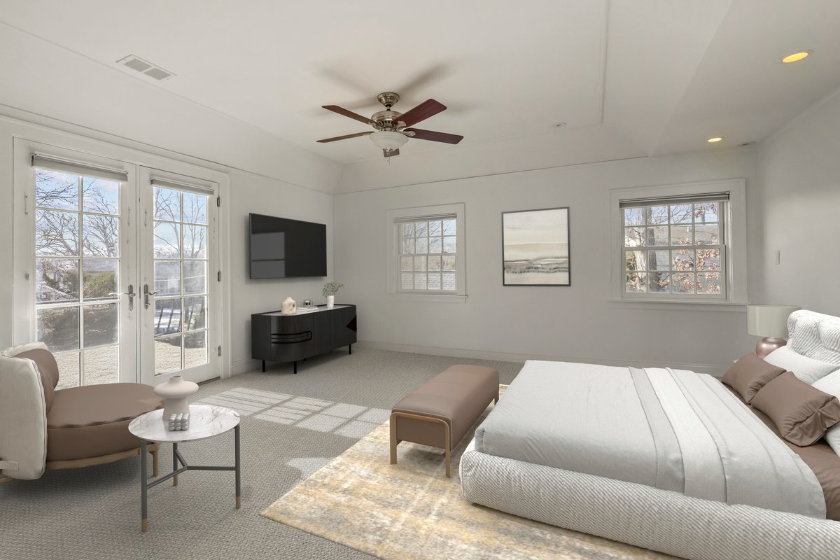 1878 Sunset Road Highland Park, IL 60035 - Photo 17 of 40 a spacious bedroom with a bed and a flat screen tv