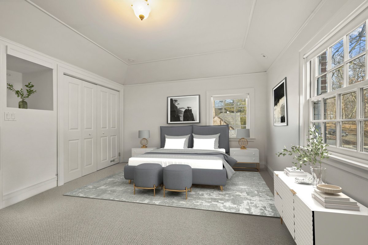 1878 Sunset Road Highland Park, IL 60035 - Photo 20 of 40 a spacious bedroom with a bed a couch and a window