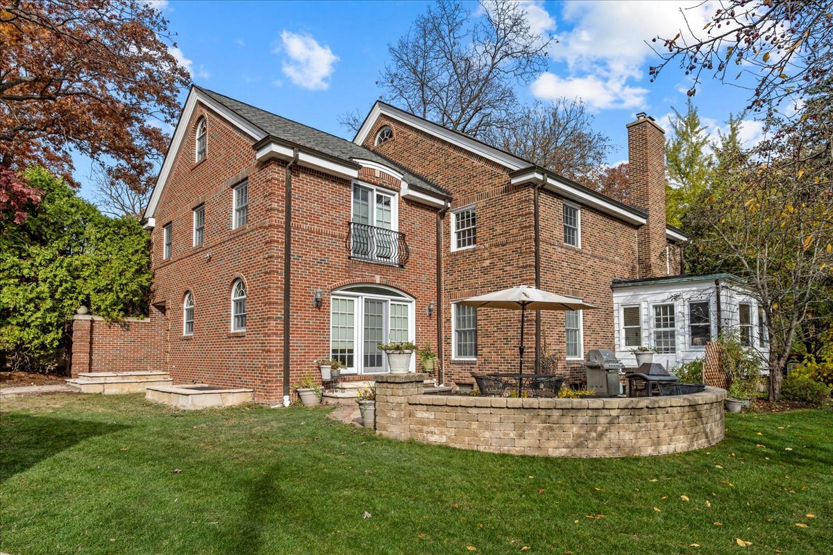1878 Sunset Road Highland Park, IL 60035 - Photo 32 of 40 a front view of a house with a yard table and chairs