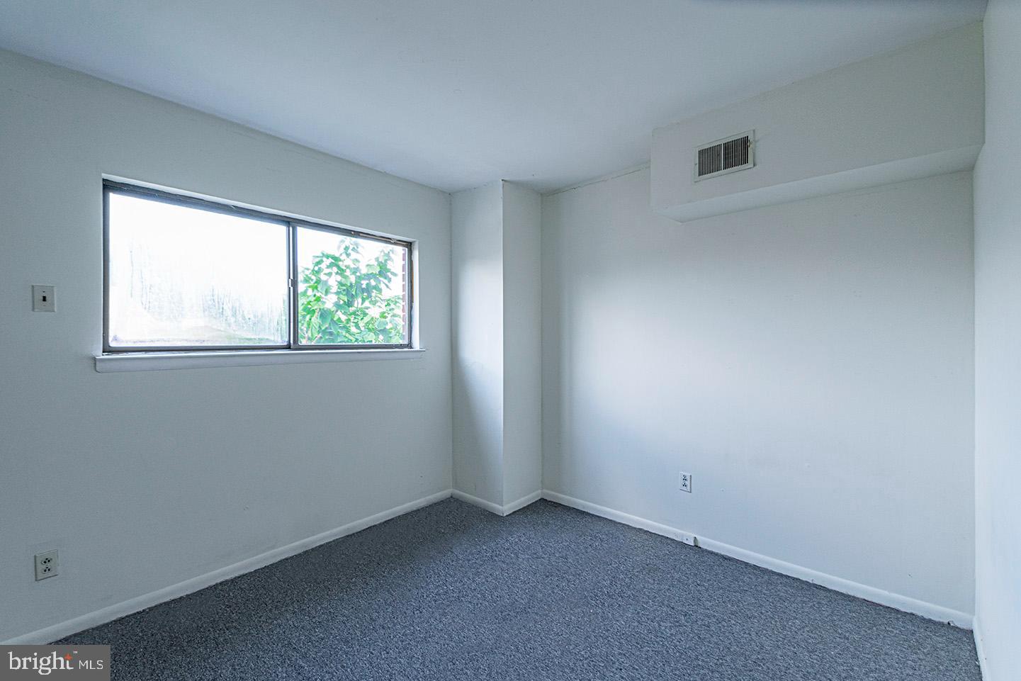 4118 Baltimore Avenue, Unit A Philadelphia, PA 19104 - Photo 18 of 25 an empty room with windows