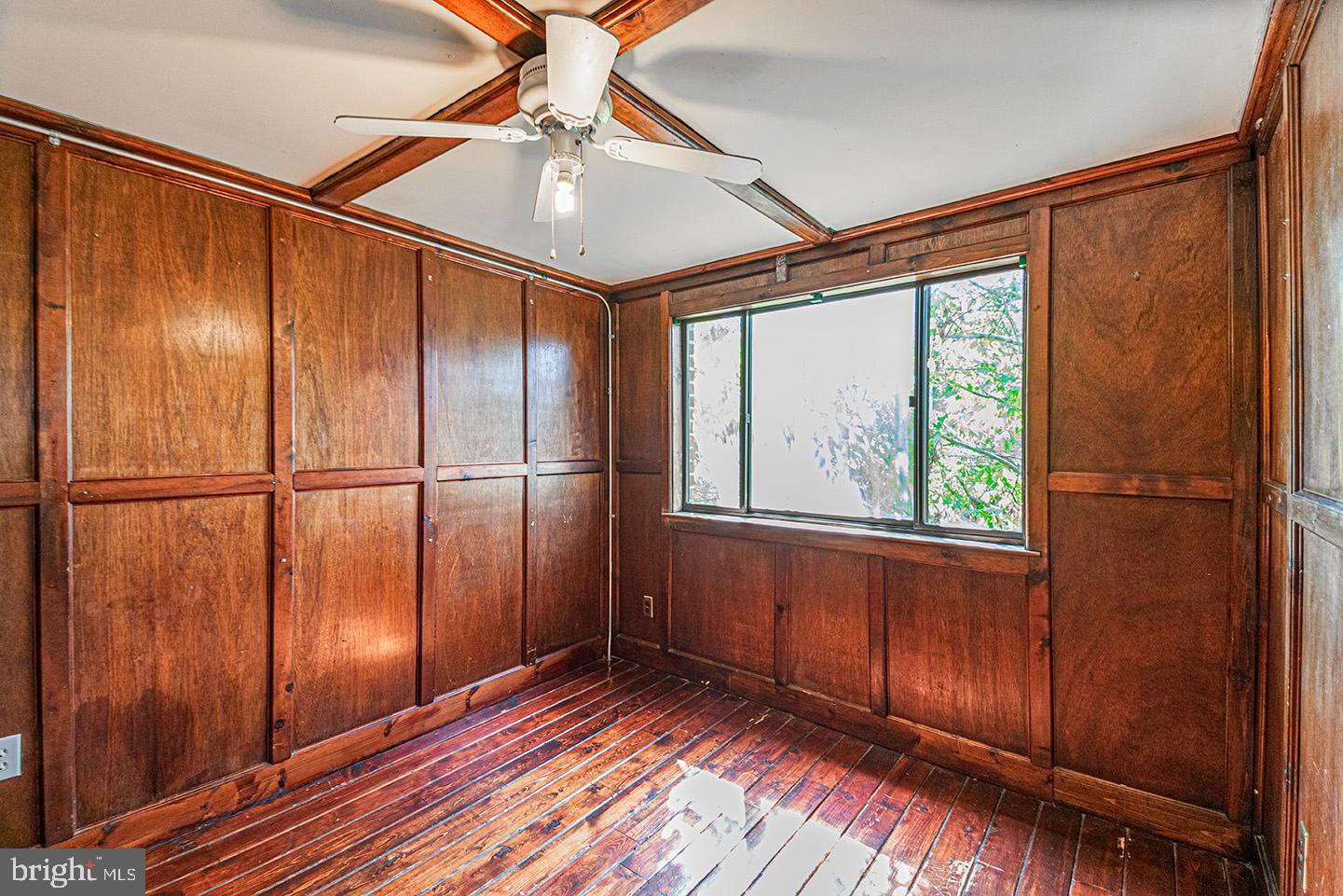 4118 Baltimore Avenue, Unit A Philadelphia, PA 19104 - Photo 22 of 25 a view of an empty room with wooden floor and a window
