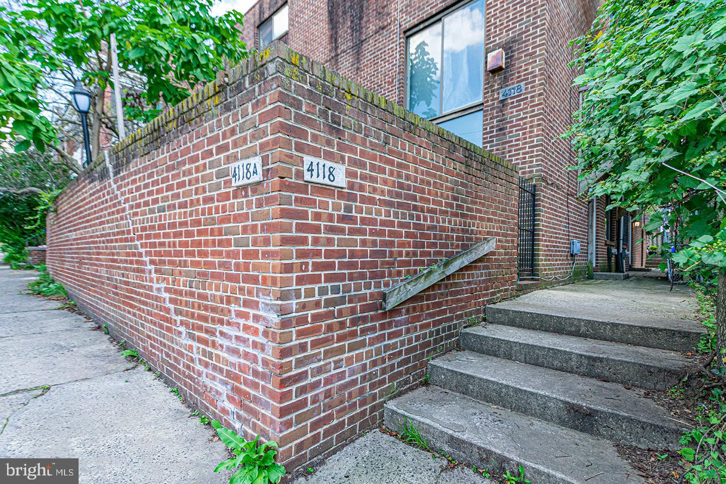 4118 Baltimore Avenue, Unit A Philadelphia, PA 19104 - Photo 24 of 25 a front view of a building with garden