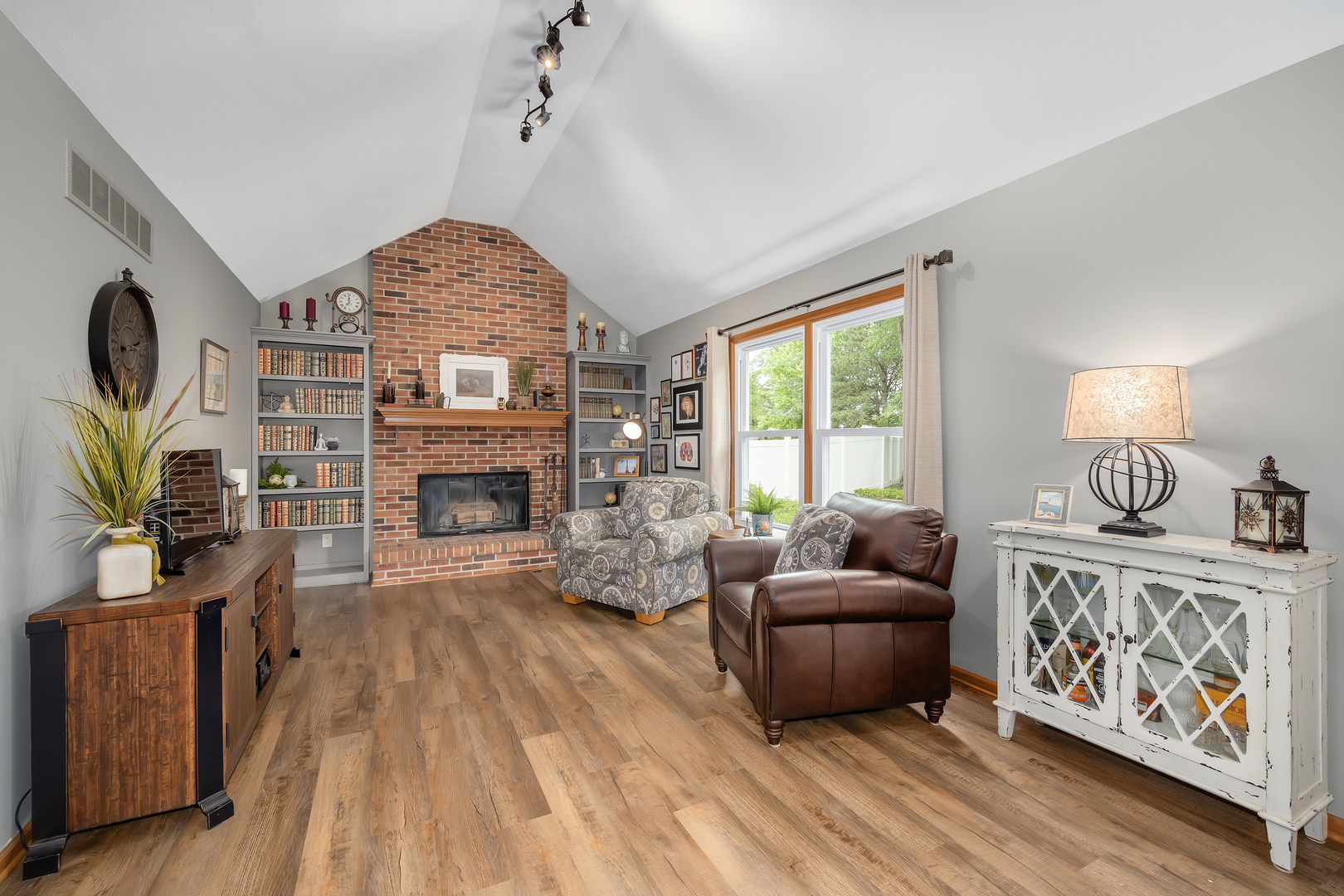 2499 Highland Road Geneva, IL 60134 - Photo 13 of 29 a living room with furniture and a fireplace