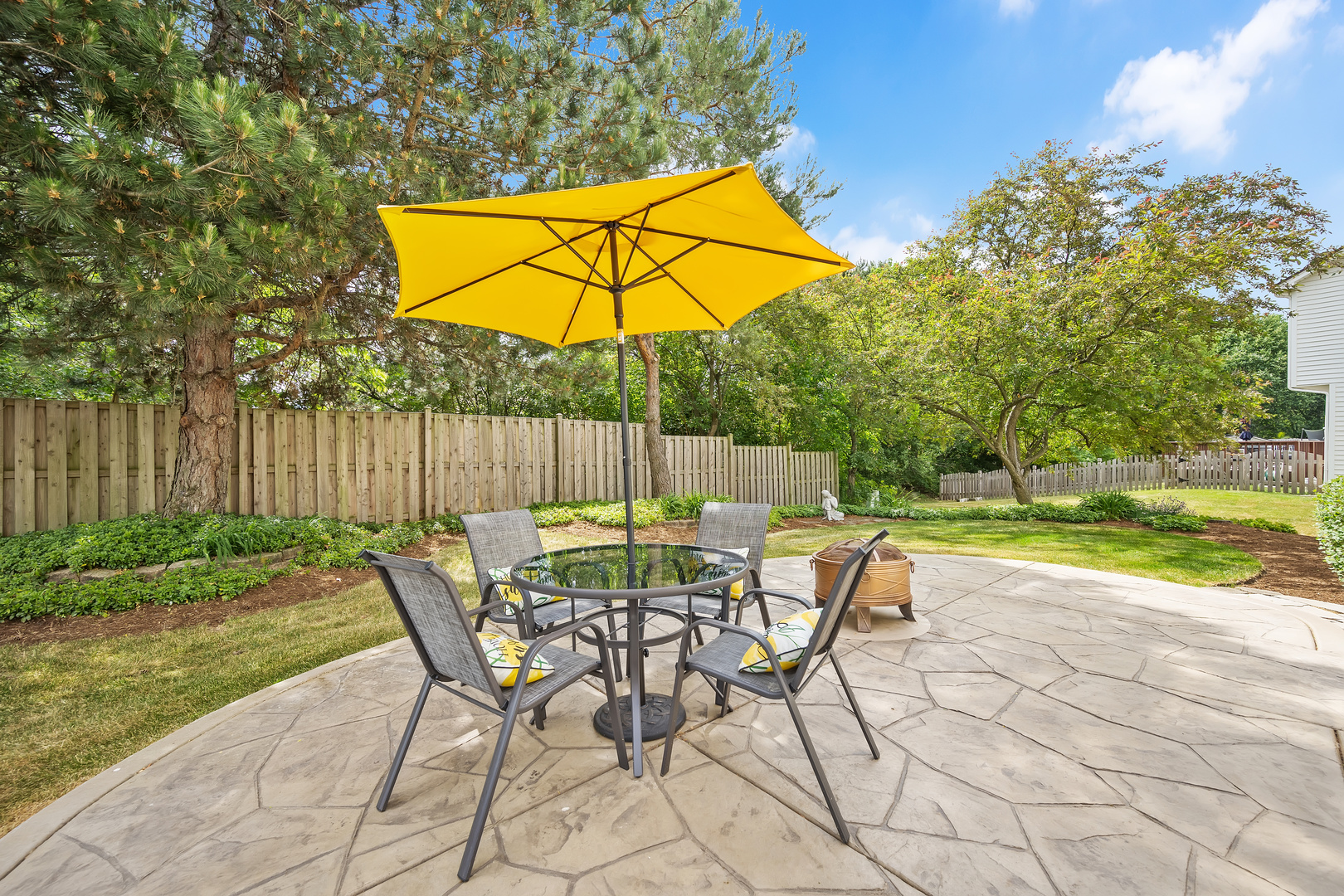 2499 Highland Road Geneva, IL 60134 - Photo 23 of 29 a view of backyard with table and chairs under an umbrella