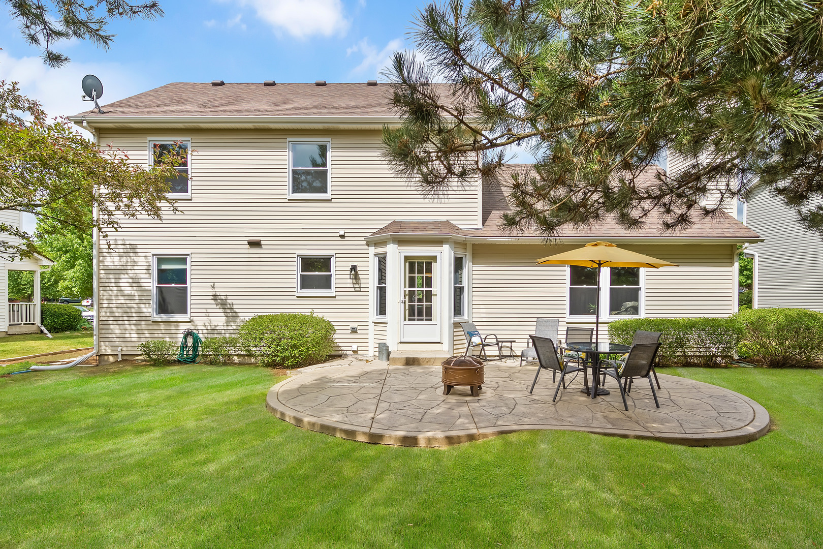 2499 Highland Road Geneva, IL 60134 - Photo 24 of 29 a view of a house with a yard patio and fire pit