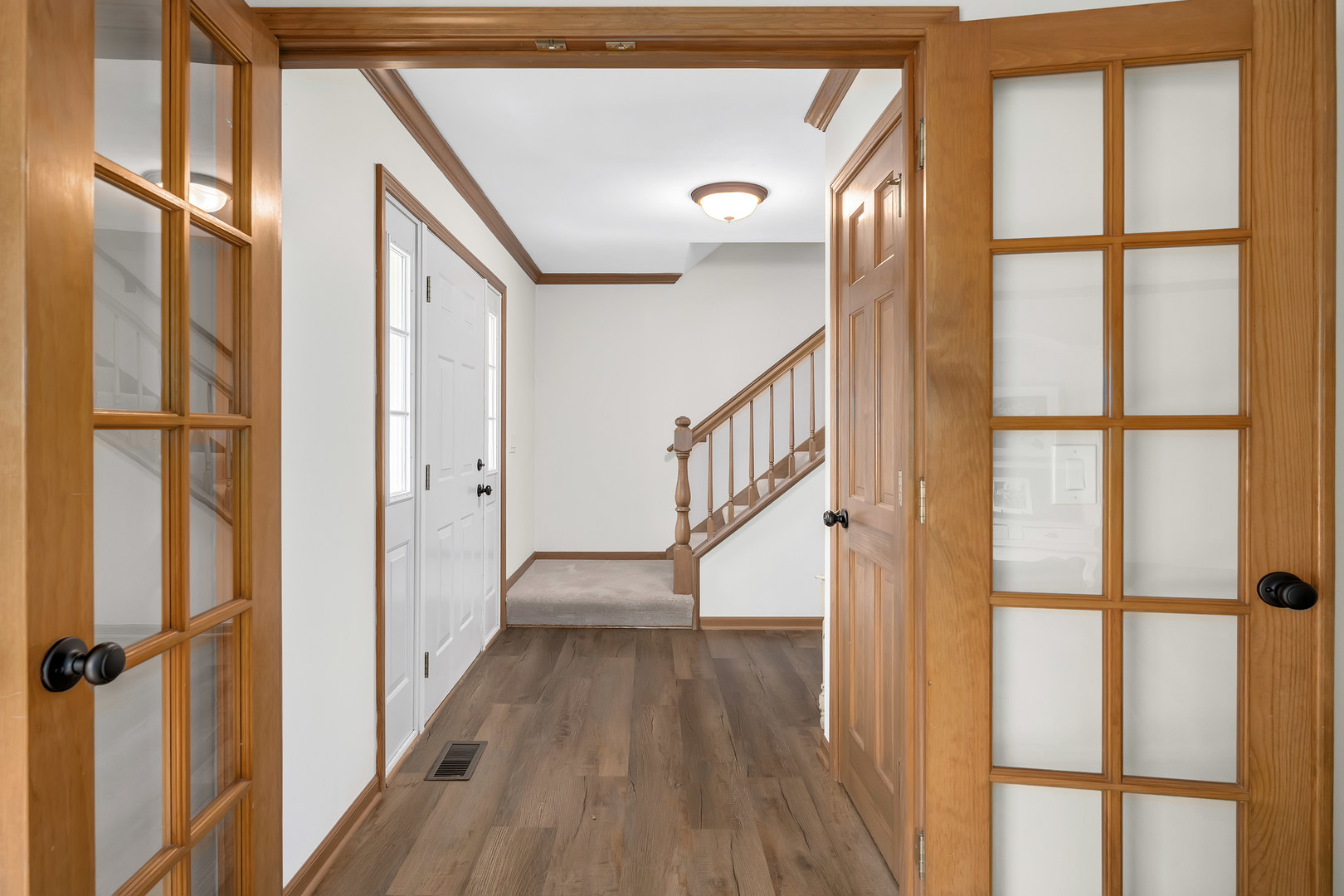 2499 Highland Road Geneva, IL 60134 - Photo 3 of 29 a view of an entryway with wooden floor