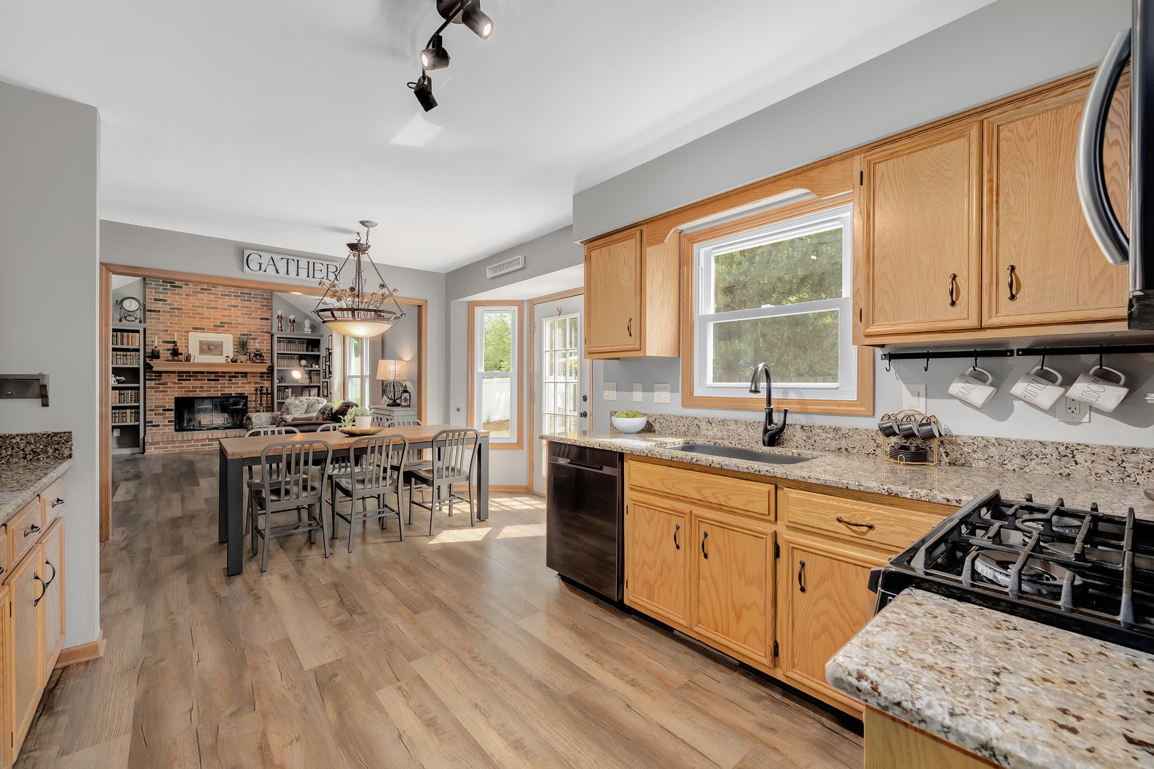 2499 Highland Road Geneva, IL 60134 - Photo 10 of 29 a kitchen with stainless steel appliances a stove a sink a dining table and chairs
