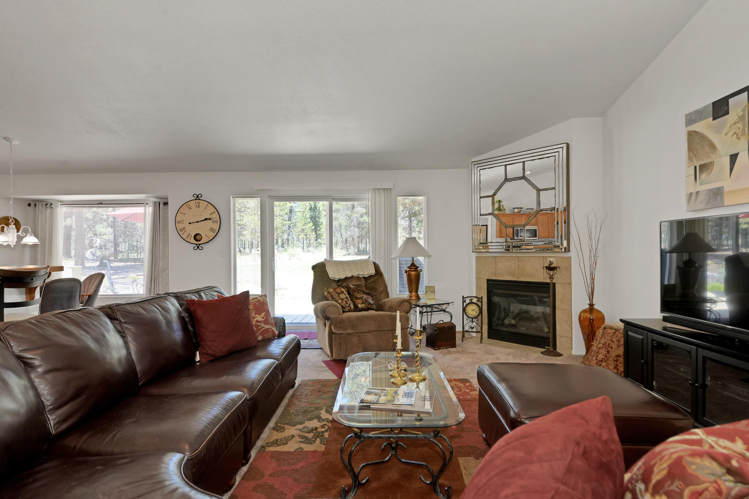 52311 Ammon Road La Pine, OR 97739 - Photo 6 of 39 a living room with furniture fireplace and flat screen tv