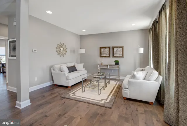 a living room with fireplace furniture and a flat screen tv