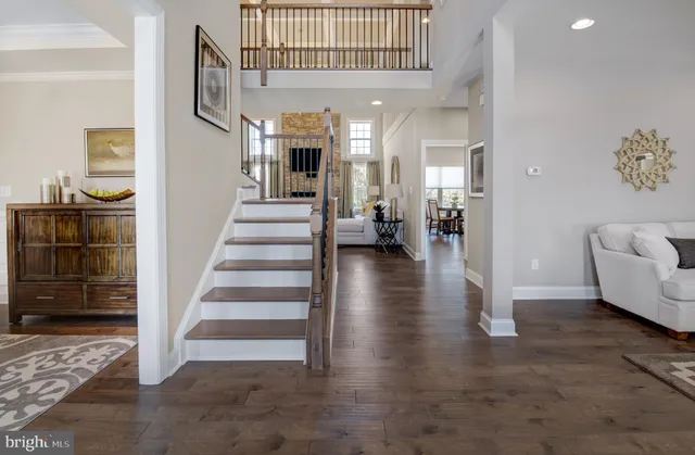 a spacious bedroom with a bed a couch and dresser