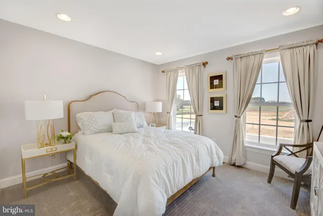 a living room with a couch and a rug