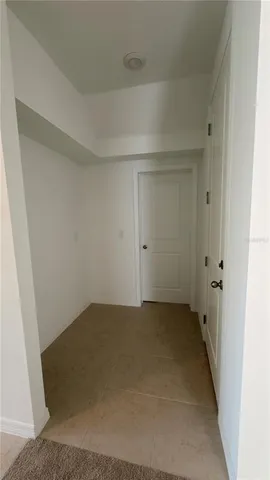 a utility room with a sink a toilet and a mirror