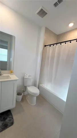 an empty room with a empty space and window