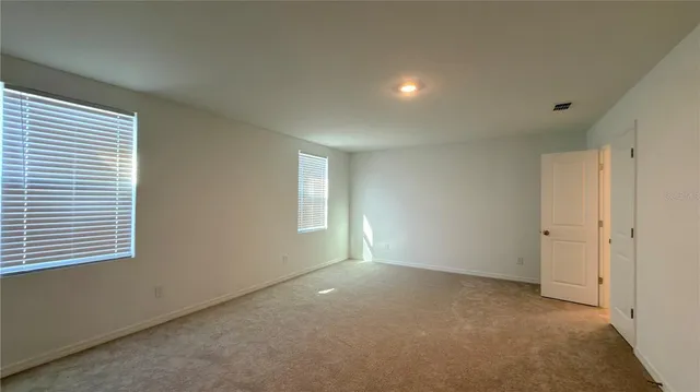 a bathroom with a toilet a sink and a mirror