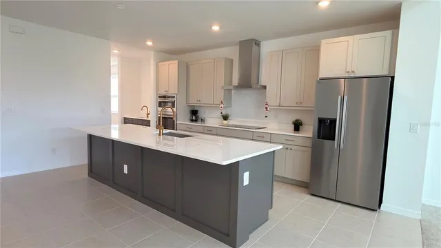 a kitchen that has a lot of cabinets in it