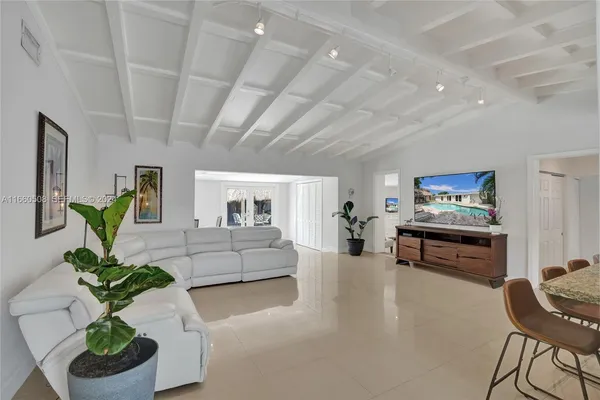 a living room with furniture and a couch