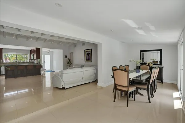 a view of a dining room with furniture and a livingroom