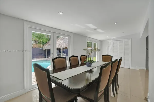 a view of a dining room with furniture window and outside view