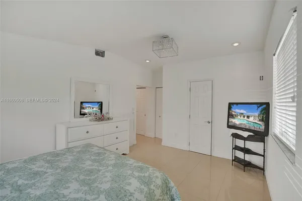 a room with a bed and a television in it
