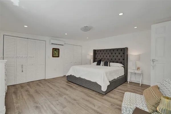 a bedroom with a bed and closet