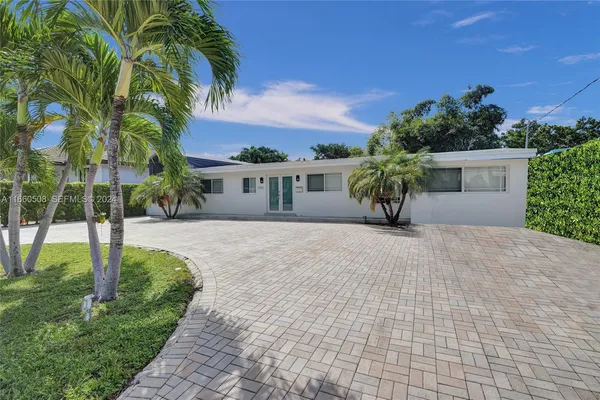 a view of house with yard and entertaining space