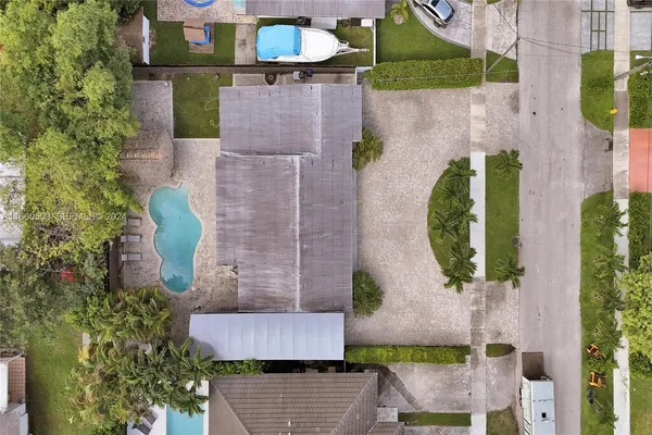 an aerial view of a house with outdoor space