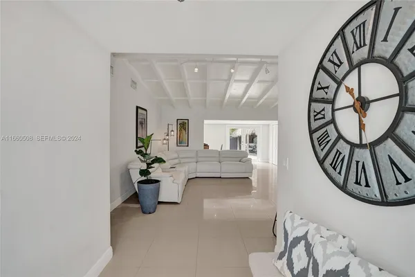 a view of living room with furniture and white walls