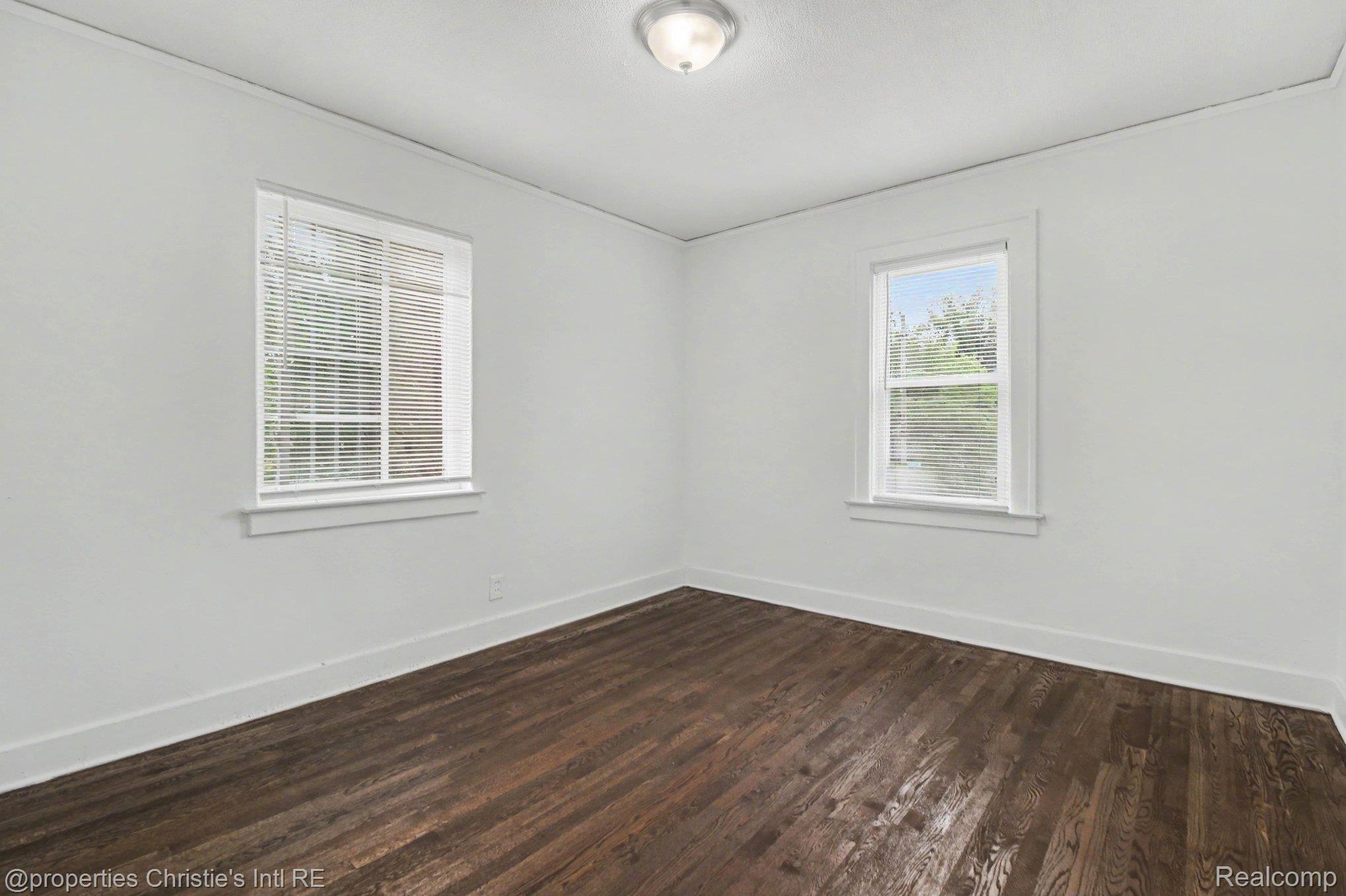 5911 Yorkshire Road Detroit, MI 48224 - Photo 9 of 14 Neutral wall finishes with crisp white trim