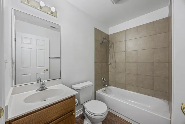 a bathroom with a sink a toilet and a bathtub